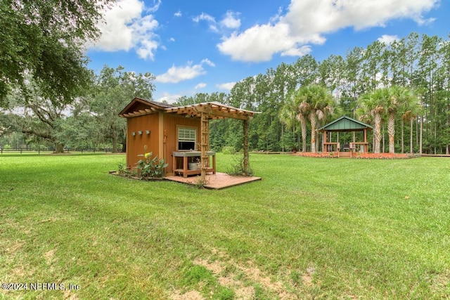 view of yard with fence, a gazebo, and a pergola