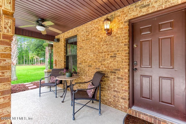 view of exterior entry with ceiling fan