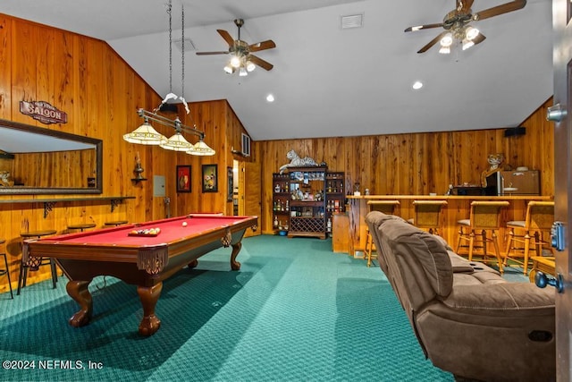 game room featuring vaulted ceiling, wooden walls, pool table, and carpet flooring