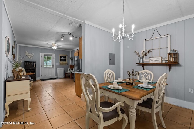 dining space with ceiling fan with notable chandelier, crown molding, a textured ceiling, light tile patterned floors, and electric panel