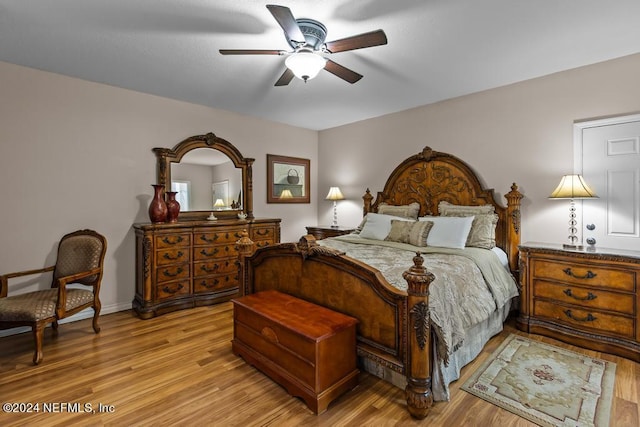 bedroom with baseboards, ceiling fan, and light wood-type flooring