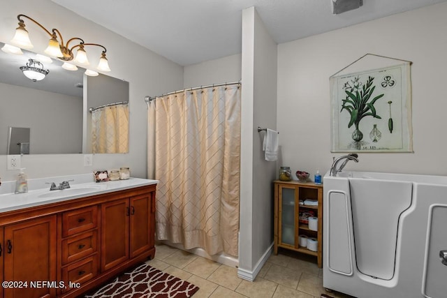 full bathroom with a shower with curtain, tile patterned flooring, and vanity