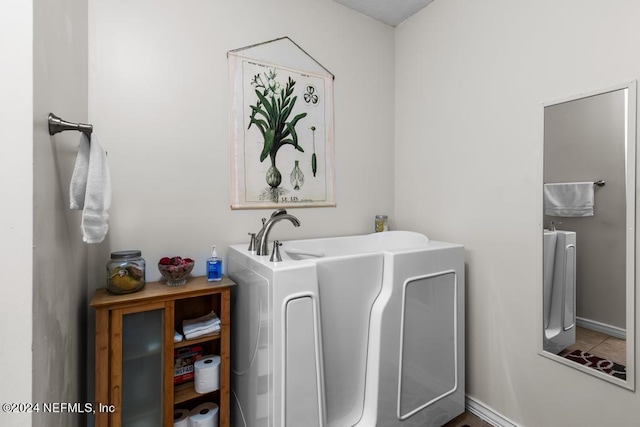 bathroom featuring a bath