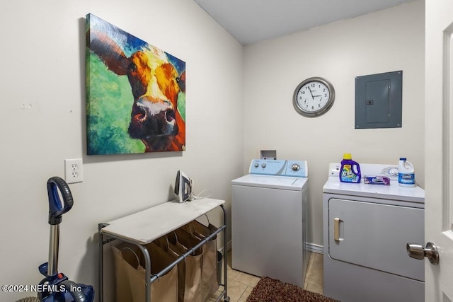 washroom with electric panel, independent washer and dryer, laundry area, and light tile patterned floors