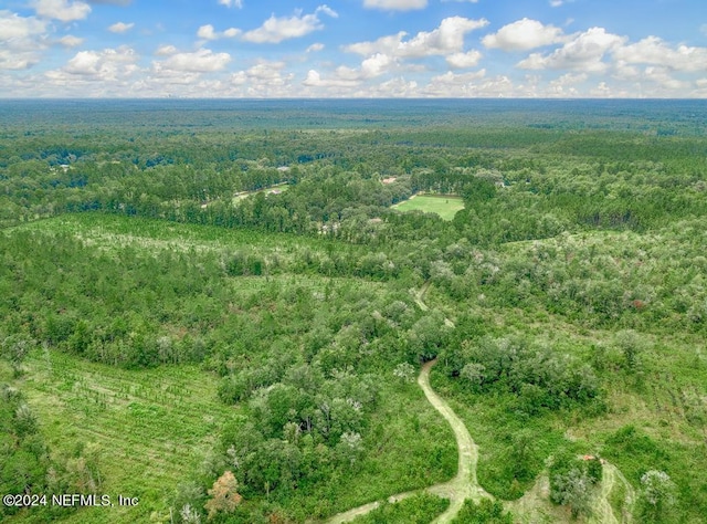aerial view featuring a view of trees