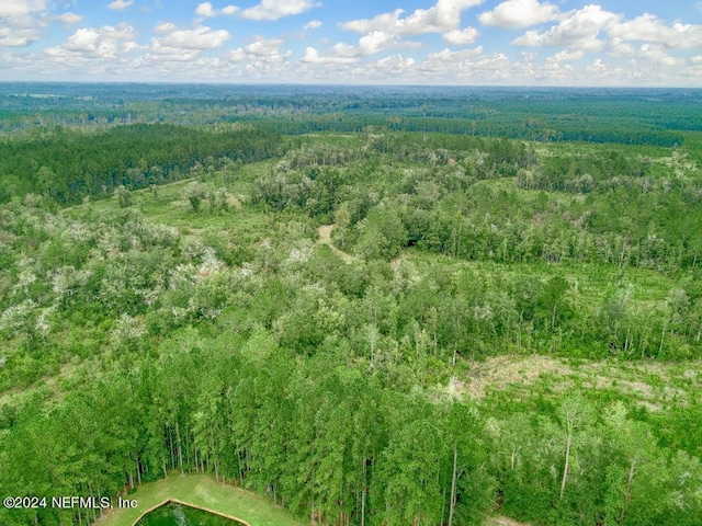 aerial view featuring a view of trees