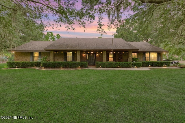 view of front of property with a lawn