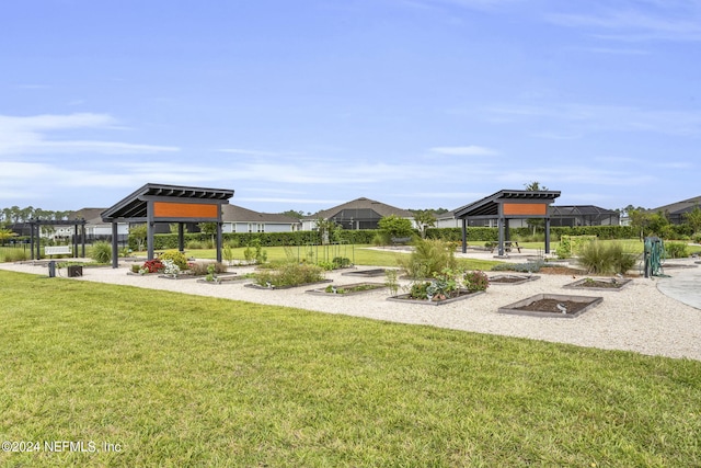 view of home's community with a gazebo and a yard