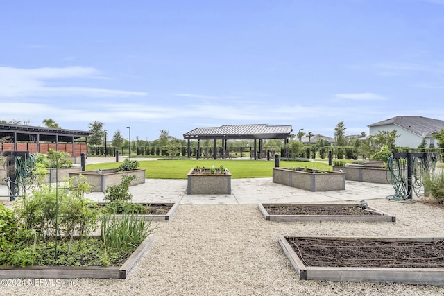 view of property's community with a yard and a gazebo