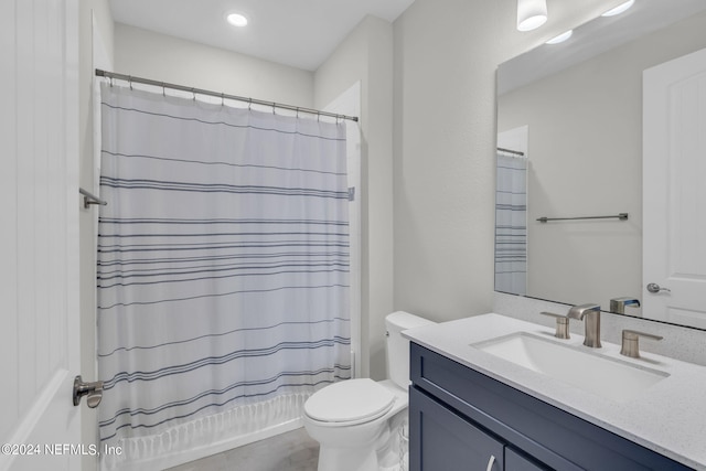 bathroom with a shower with curtain, vanity, and toilet