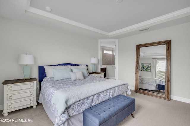 bedroom featuring crown molding, light colored carpet, and a raised ceiling