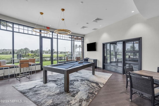 playroom with billiards, dark hardwood / wood-style flooring, and a wealth of natural light