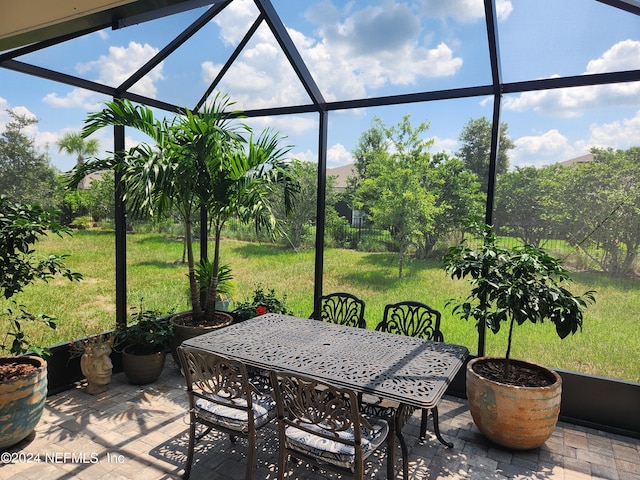 view of patio / terrace featuring glass enclosure