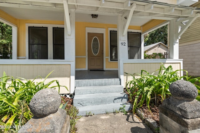 property entrance with covered porch