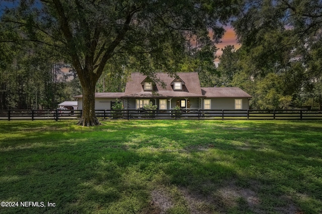 view of front of property with a yard