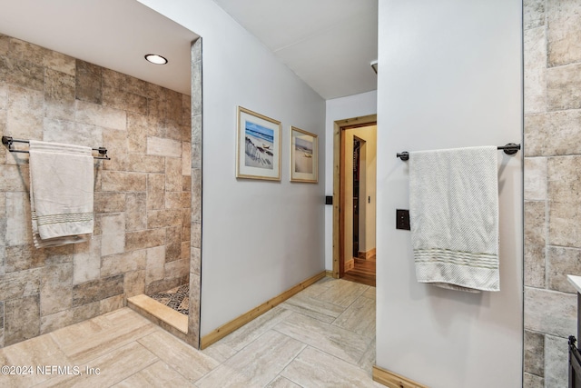 bathroom featuring a tile shower