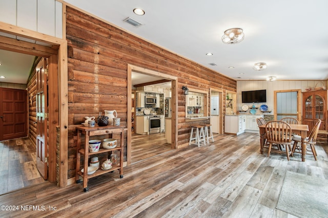 dining space featuring light wood-type flooring