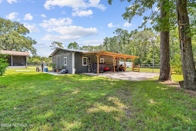 back of property with a lawn