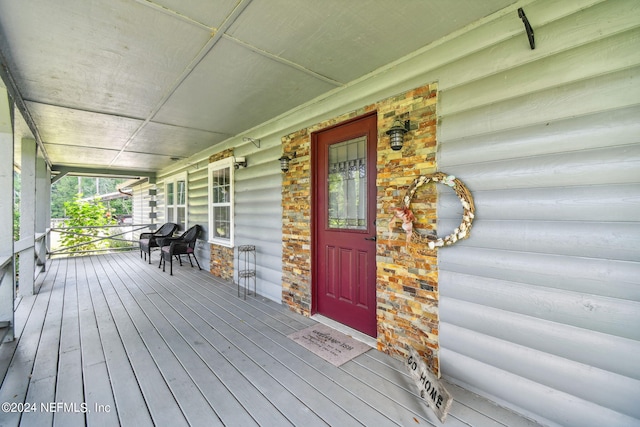 wooden terrace with a porch