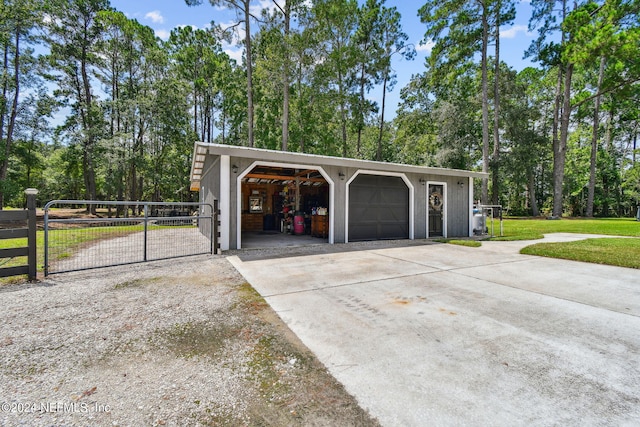 garage featuring a lawn