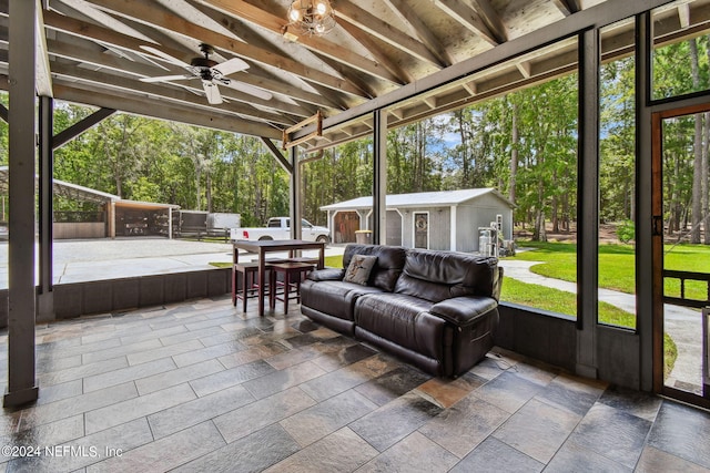 sunroom featuring ceiling fan