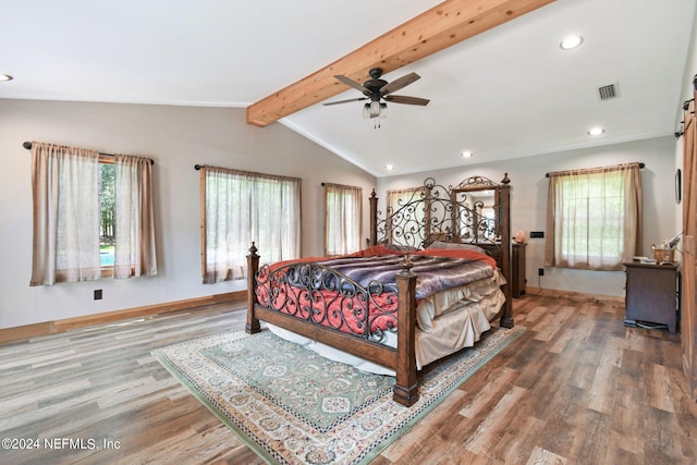 bedroom featuring wood-type flooring, lofted ceiling with beams, and ceiling fan