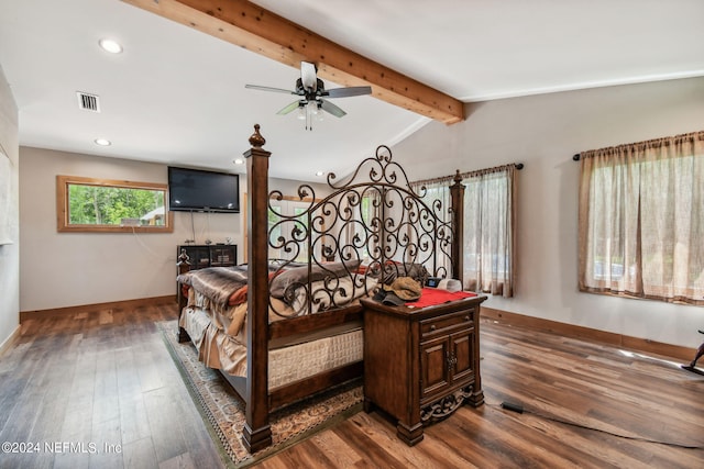 bedroom with dark hardwood / wood-style floors and vaulted ceiling with beams