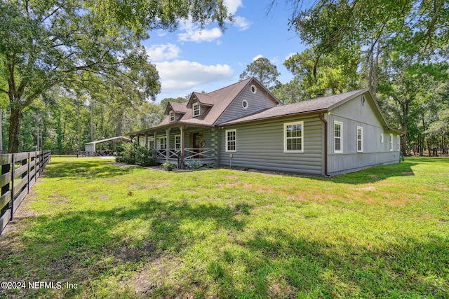 back of house with a yard