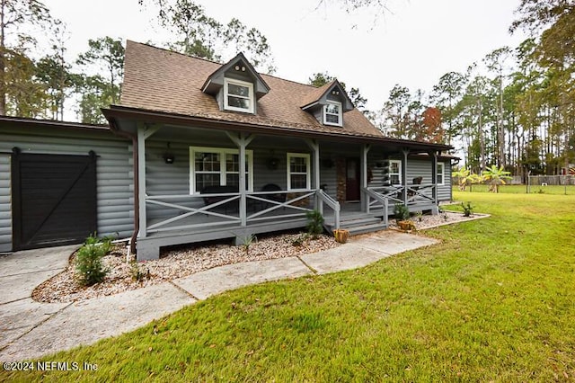 view of front of house with a porch and a front lawn