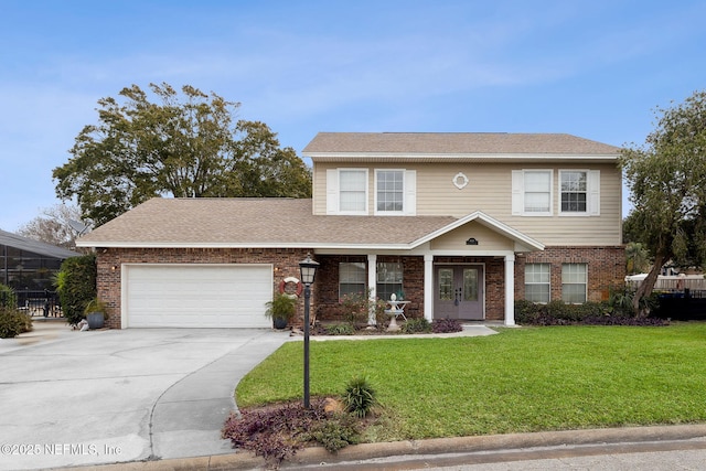 view of front facade with a garage, a front yard, and french doors