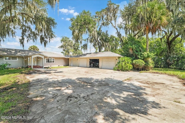 ranch-style house featuring a garage