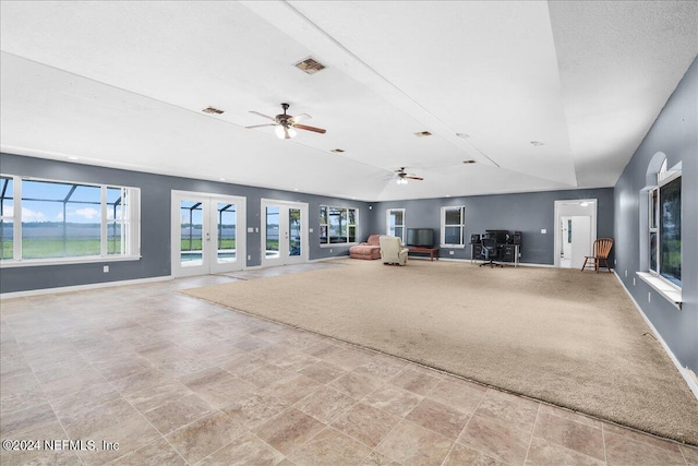157 W Grandview Dr, East Palatka, FL 32131 - unfurnished living room featuring ceiling fan, french doors, baseboards, stone finish flooring, and visible vents