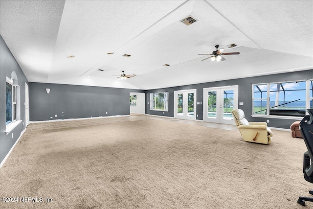 157 W Grandview Dr, East Palatka, FL 32131 - unfurnished living room featuring carpet floors, ceiling fan, and vaulted ceiling