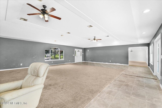 carpeted living room featuring ceiling fan