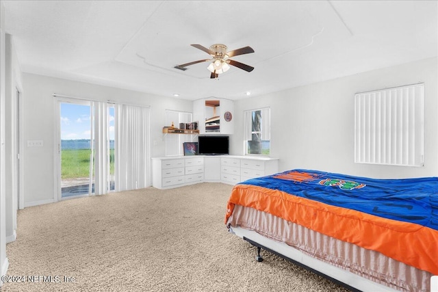 bedroom with ceiling fan, access to exterior, and carpet