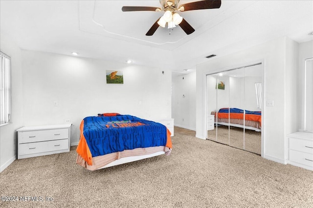 bedroom with ceiling fan and light carpet