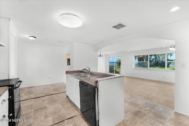 kitchen featuring light tile patterned flooring, white cabinets, sink, and black appliances