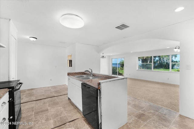 157 W Grandview Dr, East Palatka, FL 32131 - kitchen with stone finish flooring, a wealth of natural light, a sink, and black appliances