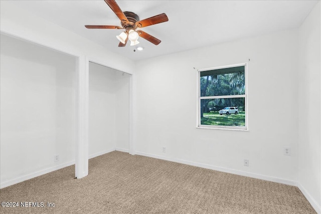 empty room with light carpet and ceiling fan