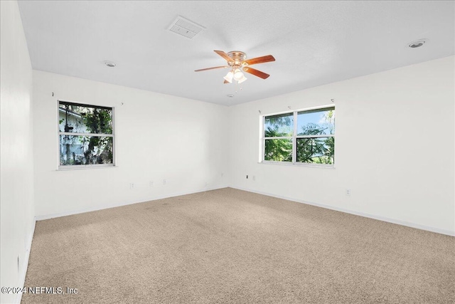 carpeted empty room with ceiling fan