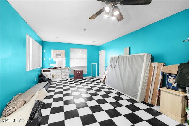 interior space featuring tile patterned floors and ceiling fan