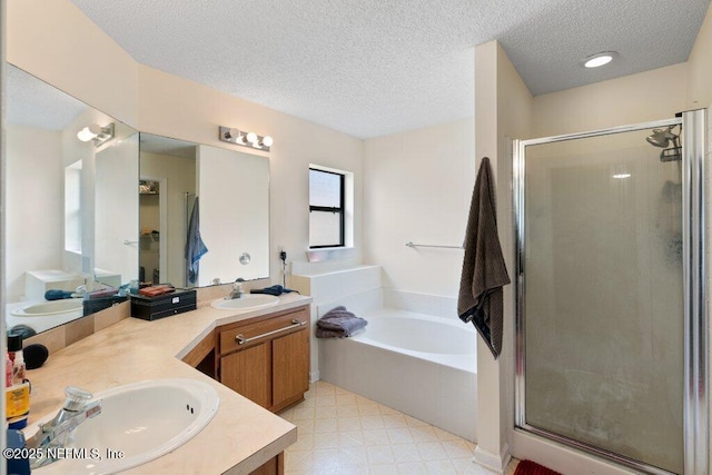 full bath with double vanity, a sink, and a shower stall