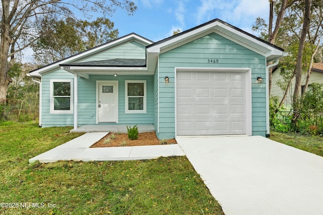 ranch-style house with a front yard and a garage