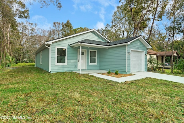 ranch-style house with a garage and a front yard