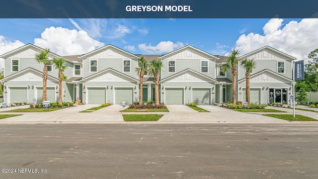 5944 Ortega Lake Dr, Jacksonville, FL 32244 - view of property featuring driveway, board and batten siding, and a garage