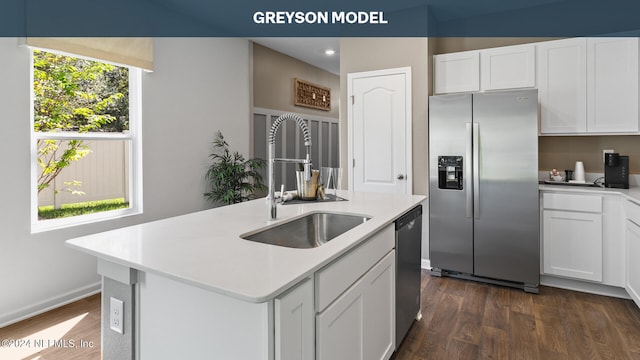 kitchen featuring white cabinetry, a center island with sink, stainless steel appliances, dark hardwood / wood-style flooring, and sink