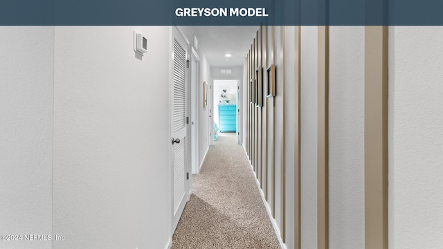 5944 Ortega Lake Dr, Jacksonville, FL 32244 - corridor featuring a textured wall and carpet flooring