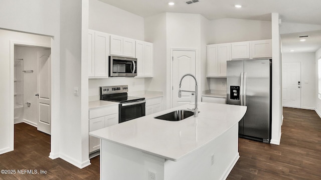 kitchen with white cabinets, an island with sink, stainless steel appliances, and sink