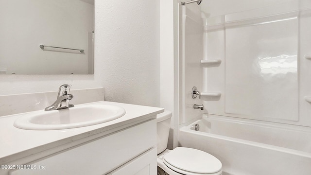 full bathroom with shower / bathtub combination, vanity, and toilet