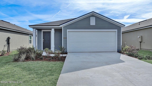 view of front facade with a garage and a front yard